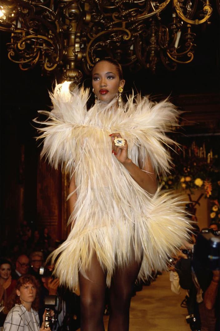 <p>Naomi Campbell wears a white furry dress at Yves Saint Laurent's Fall 1987 Haute Couture show in Paris. </p>