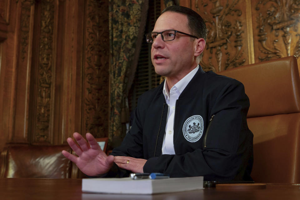 Pennsylvania Gov. Josh Shapiro speaks during an interview with the Associated Press in his office in the state Capitol in Harrisburg, Pa., Wednesday, Dec. 20, 2023. Shapiro could face a more difficult 2024 in his sophomore year in charge of Pennsylvania after his first year brought a highway collapse, a train derailment, a budget stalemate, and fallout with allies and adversaries as he navigated political divisions in a premier battleground state. (AP Photo/Daniel Shanken)