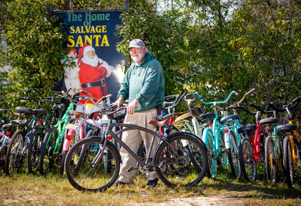 Mike Jones, aka Salvage Santa, takes old bicycles and makes them new again in his workshop on the northeast side of Panama City. Jones donates about 250 bicycles to area charities who distribute them to children for Christmas. 