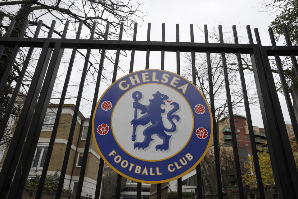 A sign on the gate at Chelsea's Stamford Bridge stadium, as the English Premier League is suspended until April 3, in London, Friday, March 13, 2020. Chelsea's Callum Hudson-Odoi has tested positive for coronavirus, For most people, the new coronavirus causes only mild or moderate symptoms, such as fever and cough. For some, especially older adults and people with existing health problems, it can cause more severe illness, including pneumonia.(AP Photo/Kirsty Wigglesworth)