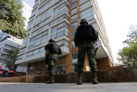 Soldiers stand guard outside a building where drug kingpin Damaso Lopez, nicknamed “The Graduate", was arrested in Mexico City, Mexico May 2, 2017. REUTERS/Henry Romero