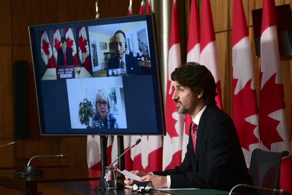 Canadian Prime Minister Justin Trudeau holds a press conference as he is joined virtually by ministers and government officials in Ottawa, Ontario, on Friday, Feb. 26, 2021, to provide an update on the COVID-19 pandemic and vaccine roll-out in Canada. (Sean Kilpatrick/The Canadian Press via AP)