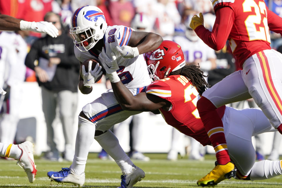 Buffalo Bills running back James Cook (28) is stopped by Kansas City Chiefs linebacker Nick Bolton during the first half of an NFL football game Sunday, Oct. 16, 2022, in Kansas City, Mo. (AP Photo/Ed Zurga)