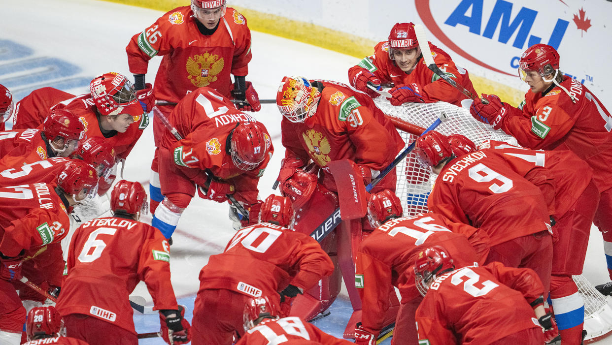 Team Russia gathers around goaltender Askarov Yaroslav
prior to first period against team Sweden during IIHF World Junior Hockey Championship action in Red Deer, Alta., Sunday, Dec. 26, 2021. THE CANADIAN PRESS/Jonathan Hayward