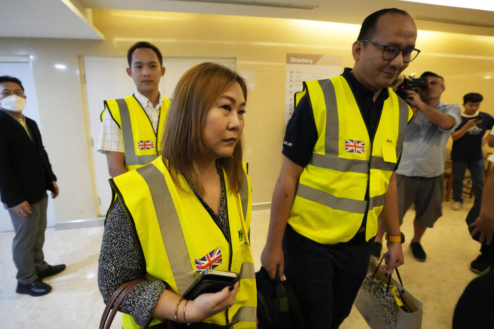 Staff members from the British Embassy arrive at Samitivej Srinakarin Hospital in Bangkok, Thailand, Wednesday, May 22, 2024, to visit passengers from Britain injured in the flight that hit severe turbulence over the Indian Ocean on Tuesday. The Singapore Airlines flight descended 6,000 feet (around 1,800 meters) in about three minutes, the carrier said Tuesday. A British man died and authorities said dozens of passengers were injured, some severely. (AP Photo/Sakchai Lalit)