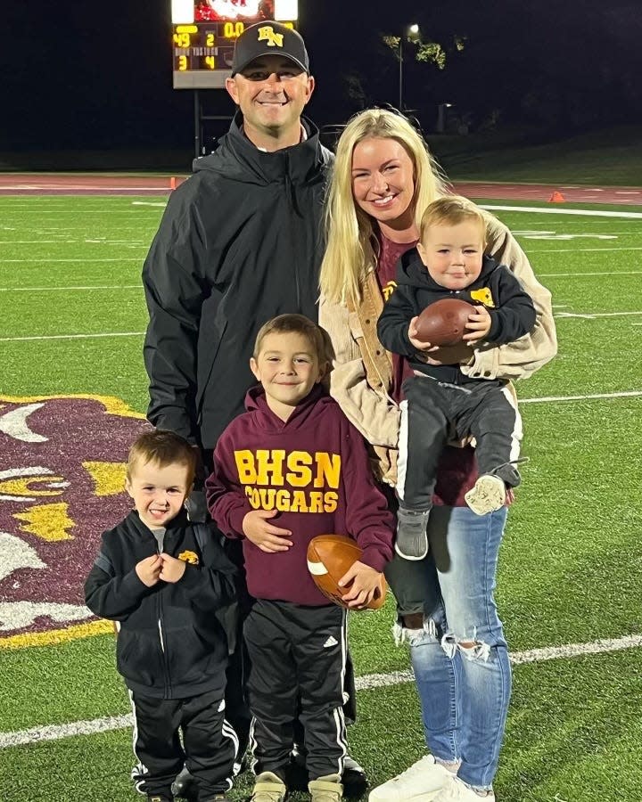 Bloomington North head football coach Anthony Lindsey poses with his wife Elizabeth and their three boys (left to right) Noah, Luke and Trey.