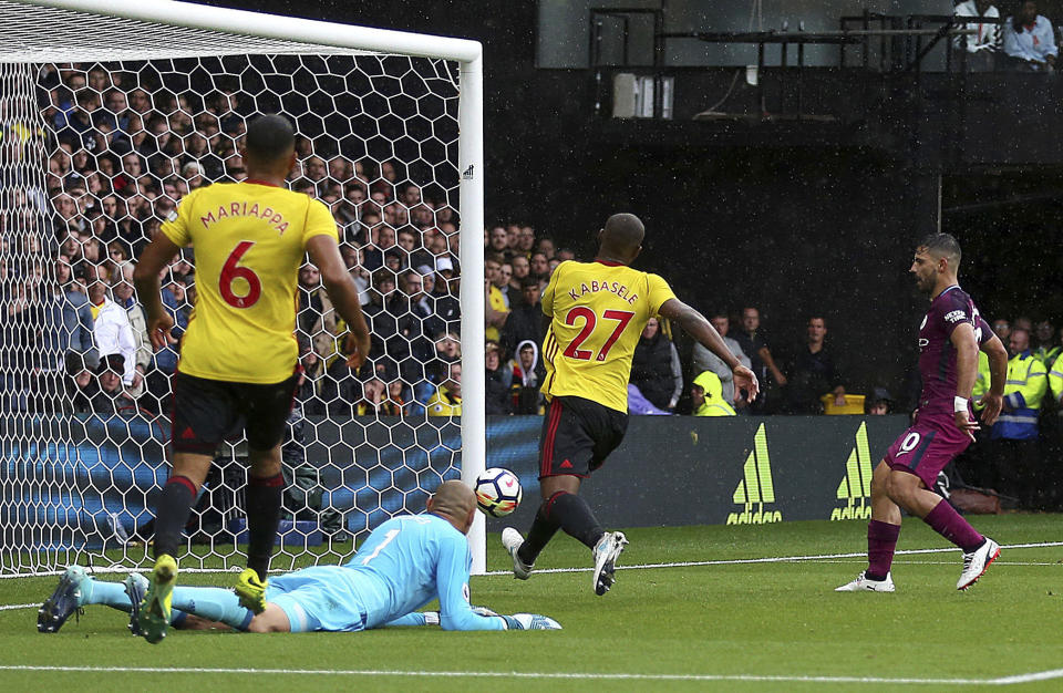 Manchester City’s Sergio Aguero, right, taps in his side’s second goal against Watford during their English Premier League soccer match at Vicarage Road in Watford, England, Saturday Sept. 16, 2017. (Nigel French/PA via AP)