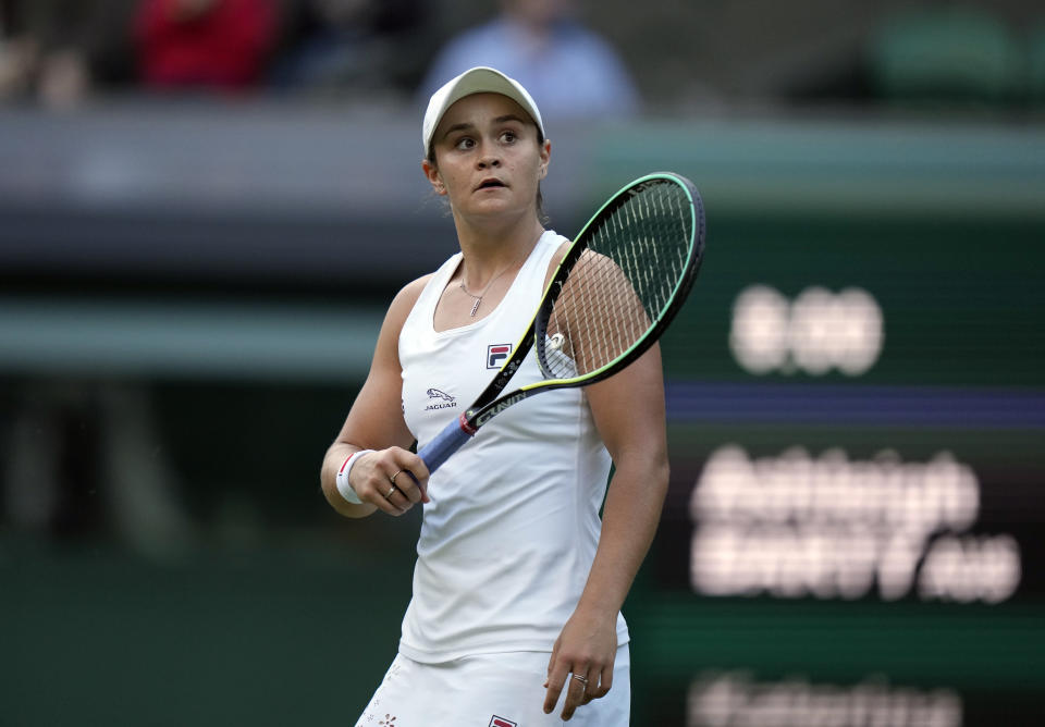 Australia's Ashleigh Barty after winning a point against Czech Republic's Katerina Siniakova during the women's singles third round match on day six of the Wimbledon Tennis Championships in London, Saturday July 3, 2021. (AP Photo/Alastair Grant)