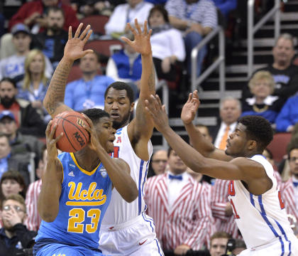 UCLA's Tony Parker is defended by SMU&#39;s Ben Emelogu and Markus Kennedy. (AP)