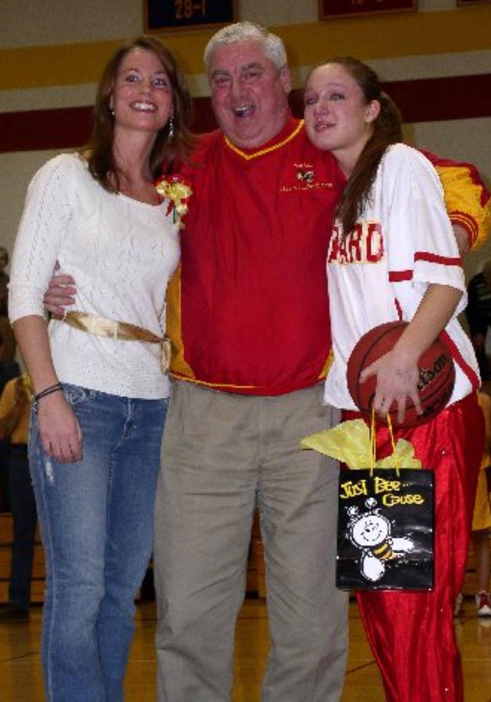 Ann Mimm Evans (left) and Carrie Nolan Stoczynski (right) pose with Girard girls basketball coach Larry Seneta in a 2005 photo. The trio were on hand for a ceremony that included the retirement of Evans' No. 40 jersey and Stoczynski's No. 11. Stoczynski (1,813 points) and Evans (1,713) remain first and second on the team's career scoring list. Evans will officially join Seneta (2009) and Stoczynski (2022) in the Metro Erie Sports Hall of Fame when she's enshrined on June 26.