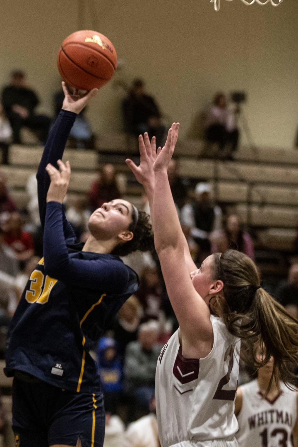 Bianka Velovic of Our Lady of Lourdes shoot over a Walt Whitman defender during a New York State girls Class AAA basketball semifinal against at Hudson Valley Community College in Troy March 16, 2024.