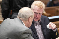 Attorney Jim Griffin speaks with Alex Murdaugh tears up after the jury was excused and the defense and prosecution teams discuss how to handle sensitive crime scene photos during his double murder trial at the Colleton County Courthouse in Walterboro, S.C, Wednesday, Jan. 25, 2023. (Joshua Boucher/The State via AP)