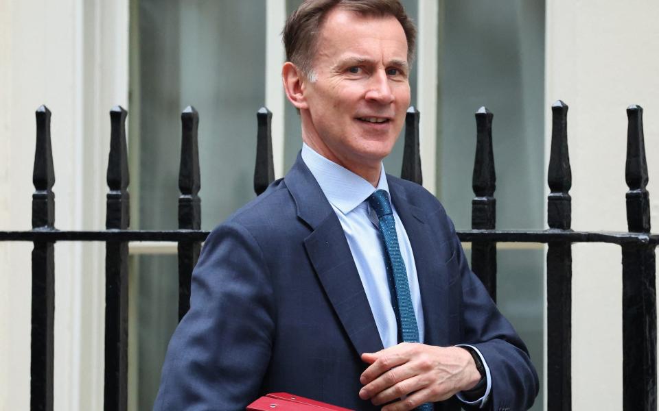 Jeremy Hunt leaves Downing Street earlier today