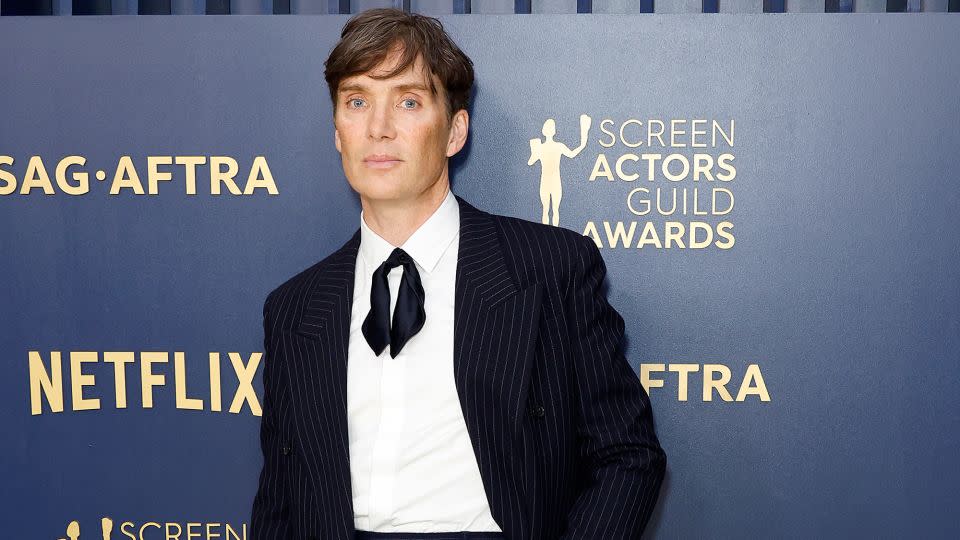 Cillian Murphy in a navy pinstripe Saint Laurent suit. - Frazer Harrison/Getty Images