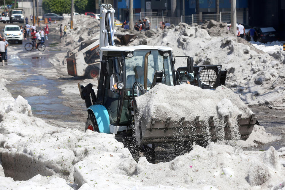 A truck carries ice as it cleans the street after a heavy storm of rain and hail which affected some areas of the city in ??Guadalajara, Mexico June 30, 2019. REUTERS/Fernando Carranza