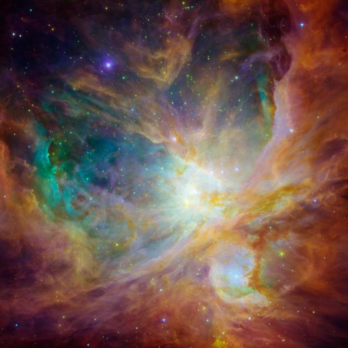 orion nebula yellow red orange green purple clouds in space full of stars
