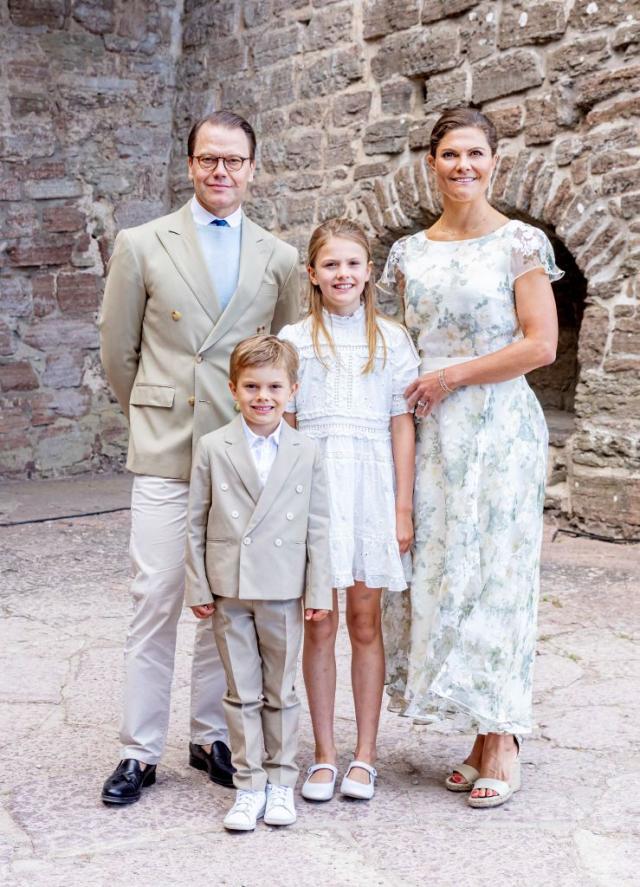 Sweden's Princess Madeleine, left holding Prince Nicolas stands next to her  husband Christopher O'Neill holding their daughter Princess Leonore, with  Queen Silvia and King Carl XVI Gustaf at right, during the christening