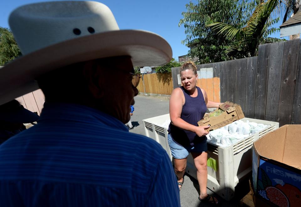 Volunteers at a monthly clandestine food distribution held by the Center for Farmworker Families in Santa Cruz County, California, in August 2019.