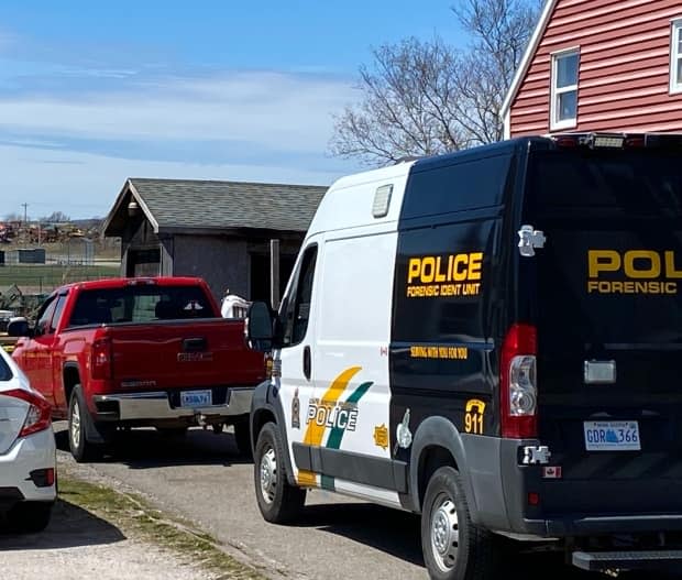 Police are investigating after a body was discovered inside a burning shed at this Sydney Mines property.  (CBC News - image credit)