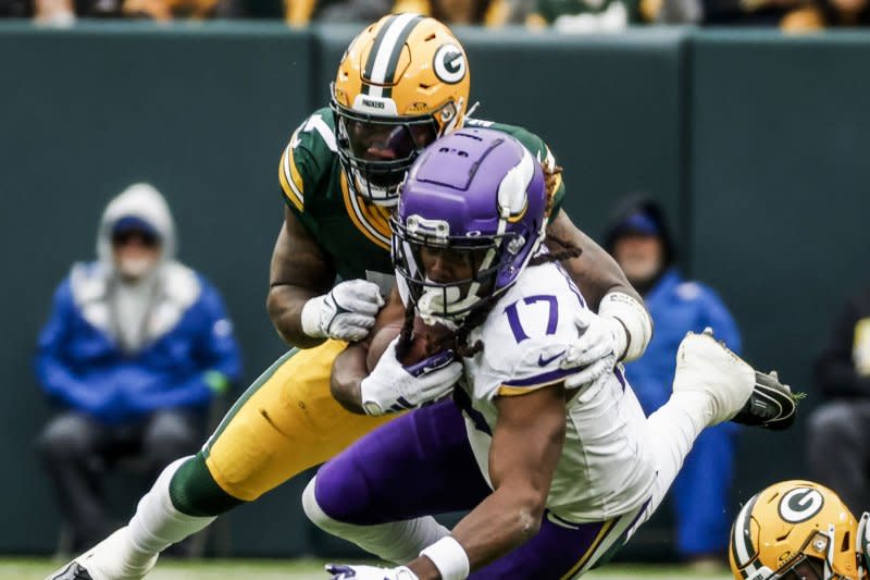 Minnesota Vikings wide receiver K.J. Osborn (R) is tackled by Green Bay Packers linebacker Quay Walker on Sunday at Lambeau Field in Green Bay, Wis. Photo by Tannen Maury/UPI
