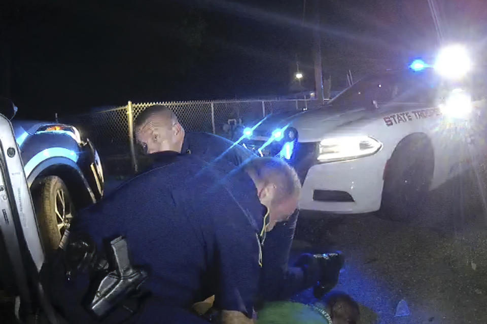 This image from video from Louisiana state trooper Lt. John Clary's body-worn camera shows troopers holding Ronald Greene on his stomach on May 10, 2019, outside of Monroe, La. The video obtained by The Associated Press shows Louisiana state troopers stunning, punching and dragging the Black man as he apologizes for leading them on a high-speed chase. (Louisiana State Police via AP)