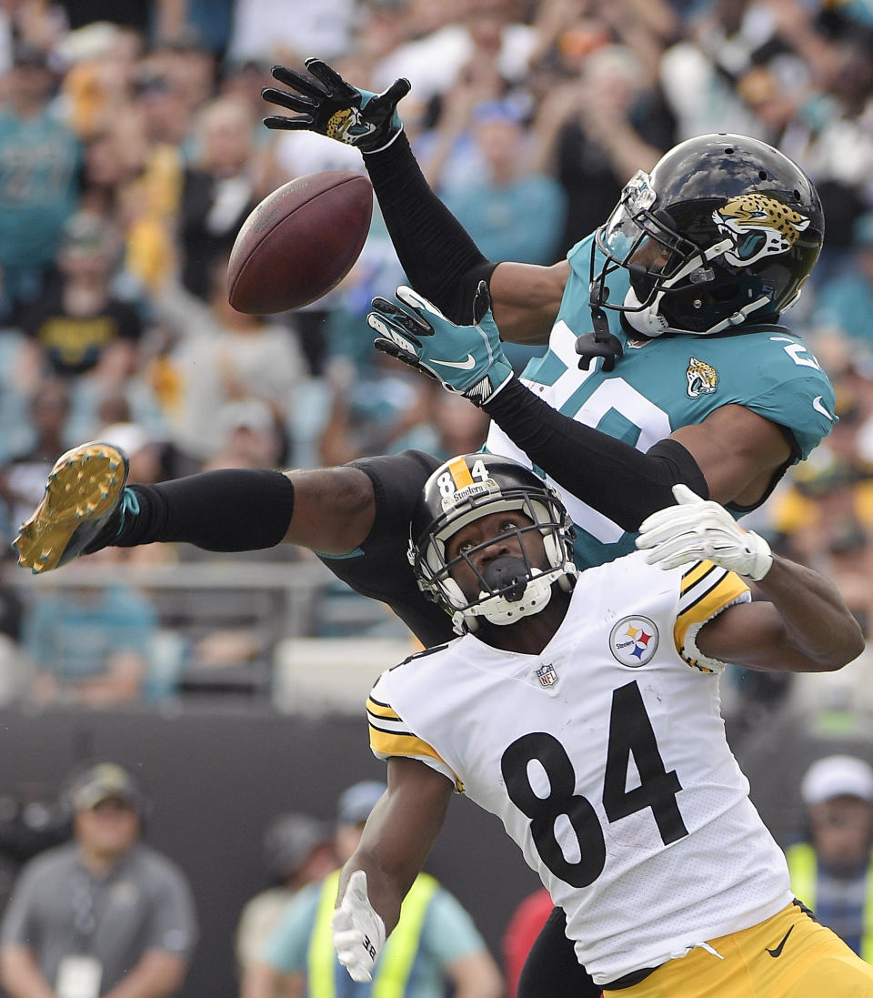 Jacksonville Jaguars cornerback Jalen Ramsey, top, intercepts a pass intended for Pittsburgh Steelers wide receiver Antonio Brown (84) in the end zone during the second half of an NFL football game, Sunday, Nov. 18, 2018, in Jacksonville, Fla. (AP Photo/Phelan M. Ebenhack)