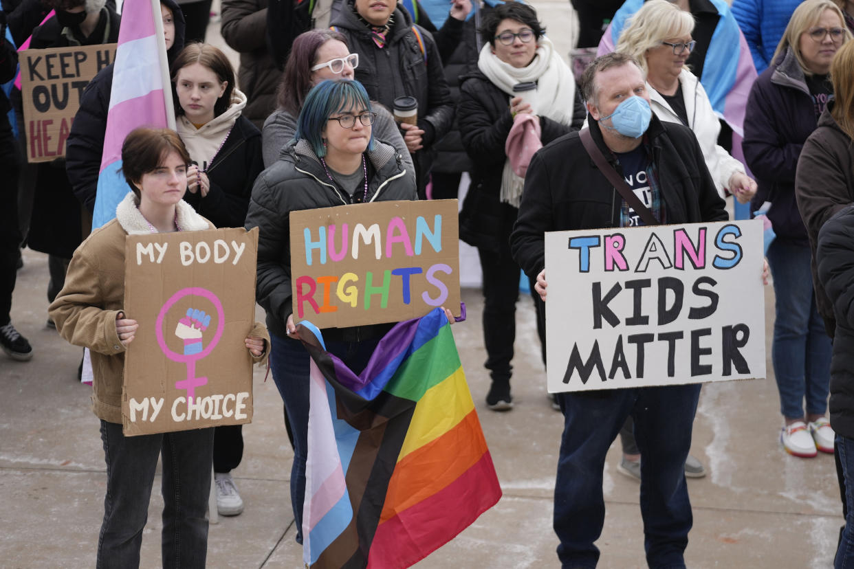 FILE - People gather in support of transgender youth during a rally at the Utah State Capitol Tuesday, Jan. 24, 2023, in Salt Lake City. Utah lawmakers on Friday, Jan. 27, 2023, gave final approval for a measure that would ban most transgender youth from receiving gender-affirming health care like surgery or puberty blockers. (AP Photo/Rick Bowmer, File)