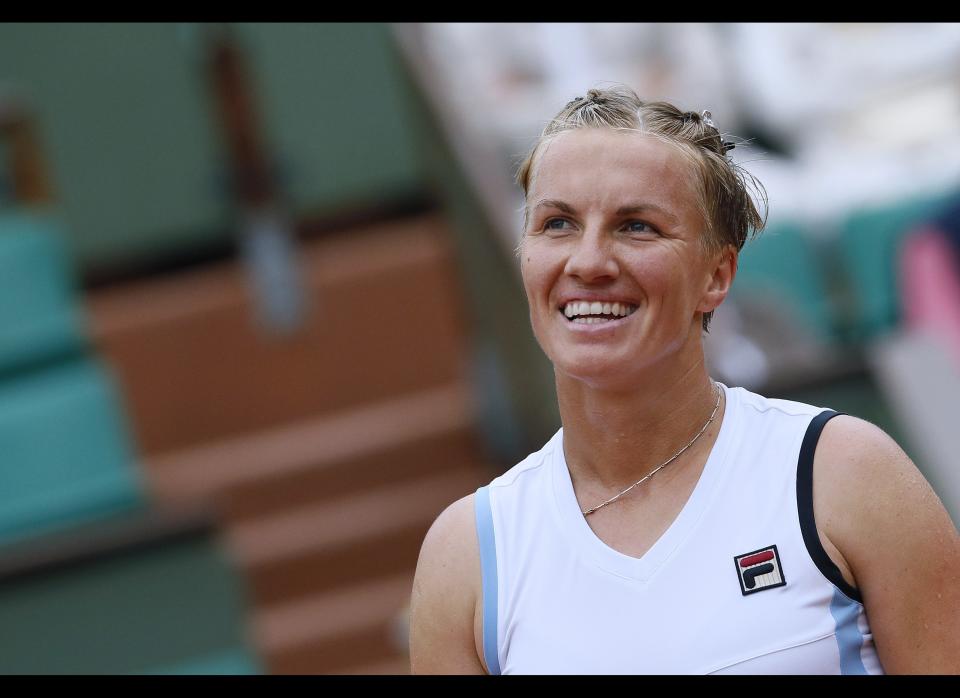 Russia's Svetlana Kuznetsova reacts after a point as she plays against Poland's Agnieszka Radwanska during their Women's Singles 3rd Round tennis match of the French Open tennis tournament at the Roland Garros stadium in Paris.        (PATRICK KOVARIK/AFP/GettyImages)