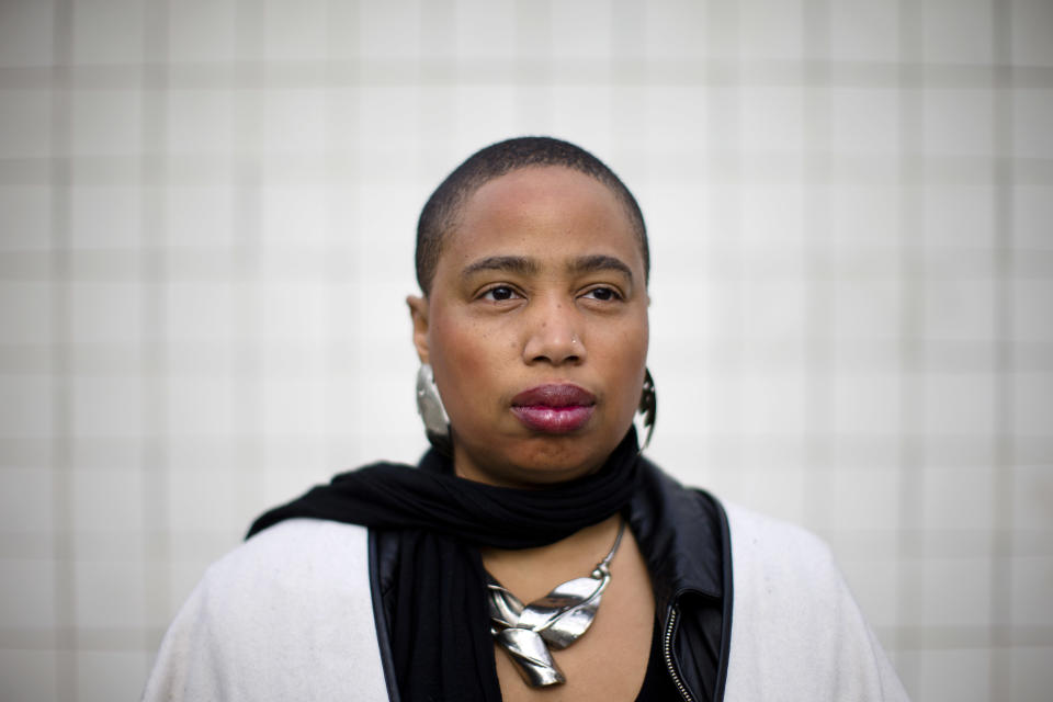 Filmmaker and writer Aishah Shahidah Simmons, who teaches in the women’s and LGBT studies program at Temple University, poses for a photograph Friday, April 25, 2014, in Philadelphia. Students on college campuses across the country are increasingly asking their professors to provide "trigger warnings" for classes that cover content that might be upsetting to individuals who have been sexually assaulted, touched by suicide, survived war or experienced other traumatic situations. Such warnings, long a feature of the blogosphere, are now cropping up on course syllabi or before lectures. Simmons is a rape and incest survivor who is “on the fence” about making trigger warnings mandatory for college faculty, but already uses them in her courses. (AP Photo/Matt Rourke)