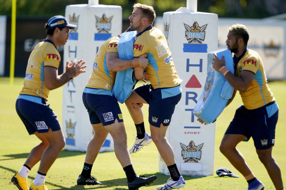 Gold Coast Titans' players of the National Rugby League train on the Gold Coast, Australia, Friday, May 15, 2020. The National Rugby League will restart its interrupted season on May 28. (Dave Hunt/AAP Image via AP)