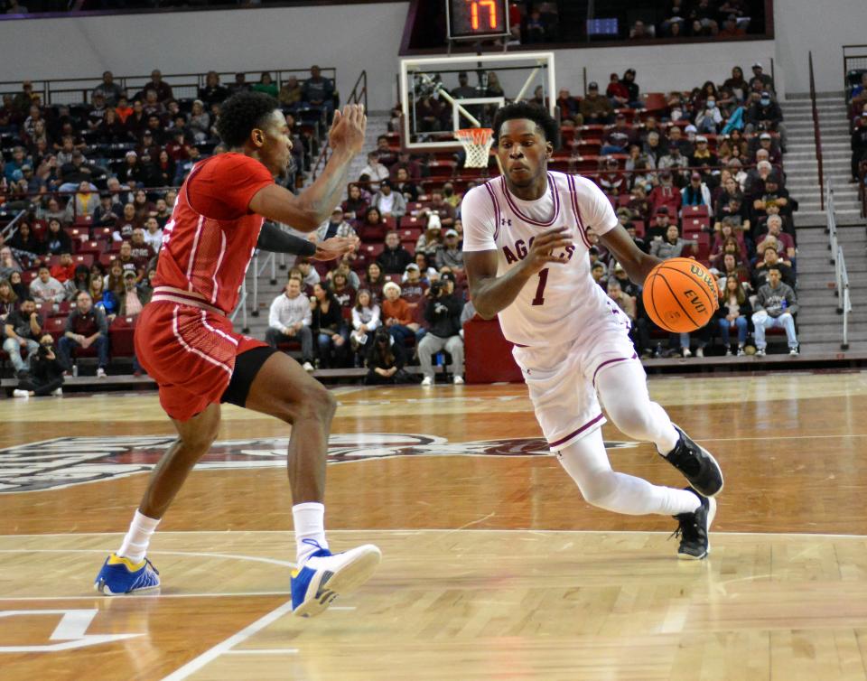 Marchelus Avery takes the ball down the lane as the Aggies took on Southern Utah on Wednesday night at the Pan Am.  Photo taken 12/28/22.