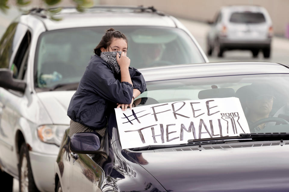 Image: Pueblo Sin Fronteras drive-by protest ICE at Otay Mesa Detention Center (Bing Guan / Reuters)