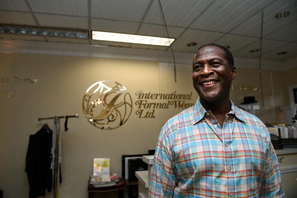 Former Broadway star Russell Joel Brown takes time for a photo opp while getting fitted for a suit at International Formal Wear in Augusta. Brown said he's been prepping six days a week for his upcoming Mozart to Motown concert to benefit his nonprofit, Boys with a Future.