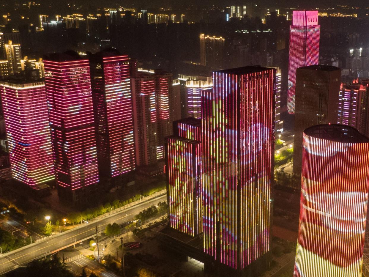 Illuminated buildings in Wuhan, China, after the city's lockdown was lifted on 8 April, 2020: Xinhua/Shutterstock