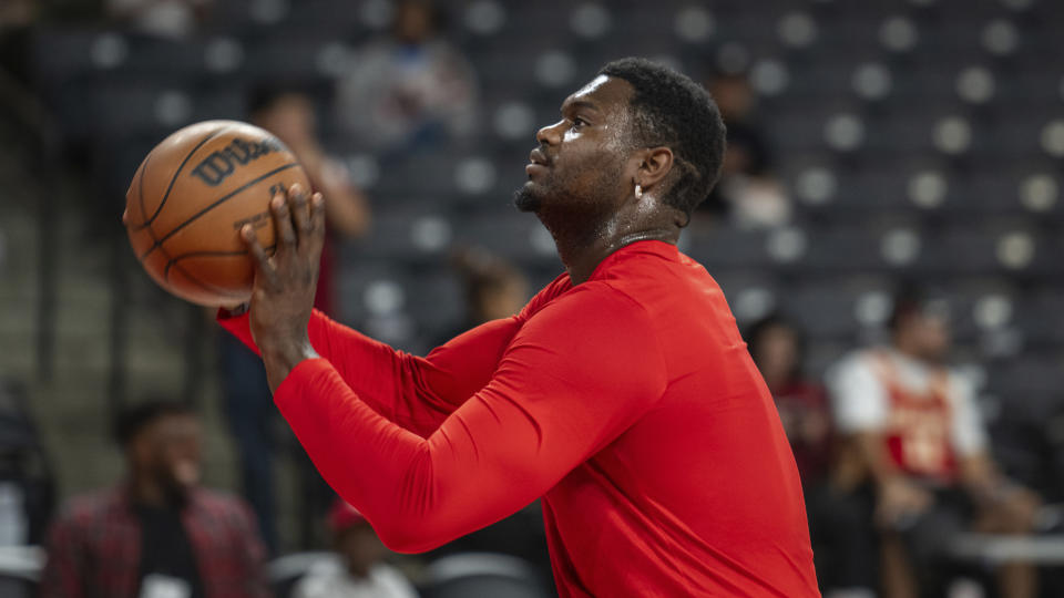 New Orleans Pelicans forward Zion Williamson (1) shoots during warm-ups before a preseason NBA basketball against the Atlanta Hawks, Saturday, Oct. 14, 2022, in College Park, Ga. (AP Photo/Hakim Wright Sr.)