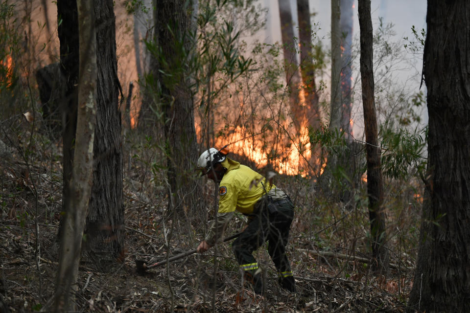 Fire crew staff putting in containment lines along the NSW South Coast. Source:AAP Image/Dean Lewins