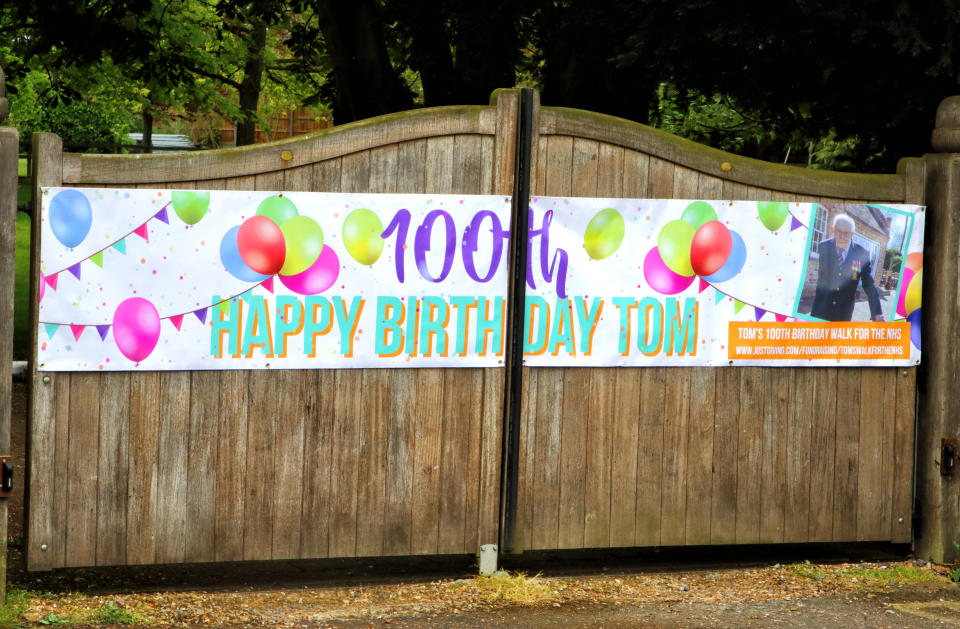  Large Banner on the gates of Captain Tom's house, The Old Rectory during the covid-19 pandemic.
Messages of Congratulations all around the village of Marston Moretaine, Bedfordshire, UK to celebrate the 100th Birthday of Captain Tom Moore, who lives with his family in the village, set out at the beginning of April to walk 100 laps of his garden to hopefully raise �1000 for the NHS (National Health Services) during the Covid-19 Pandemic. Press coverage of his walk went worldwide and the phenomenon finally raised over �32 million and cementing himself as a National - and International - Hero. (Photo by Keith Mayhew / SOPA Images/Sipa USA) 