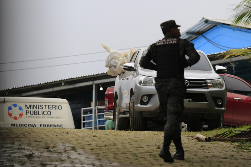 A pick-up truck loaded with the bodies of dead inmates is parked in the Tela prison where at least 18 prisoners were killed during an prisoner’s riot on Friday in Tela, Honduras, Saturday, Dec. 21, 2019. The riot came several days after Honduras declared a state of emergency in its prison system. (AP Photo/Delmer Martinez)