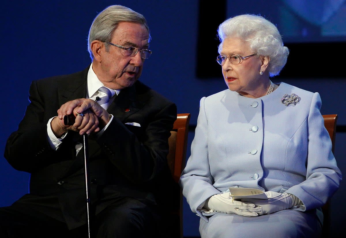 Queen Elizabeth II speaks with former King Constantine II in 2011  (AP)