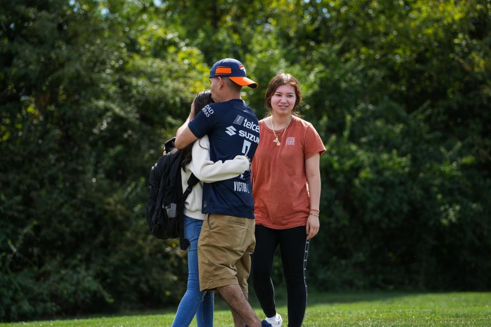 Emergency services respond to reports of a shooting at Princeton High School. Parents pick up their children at Vineyard church, down the street from Princeton.