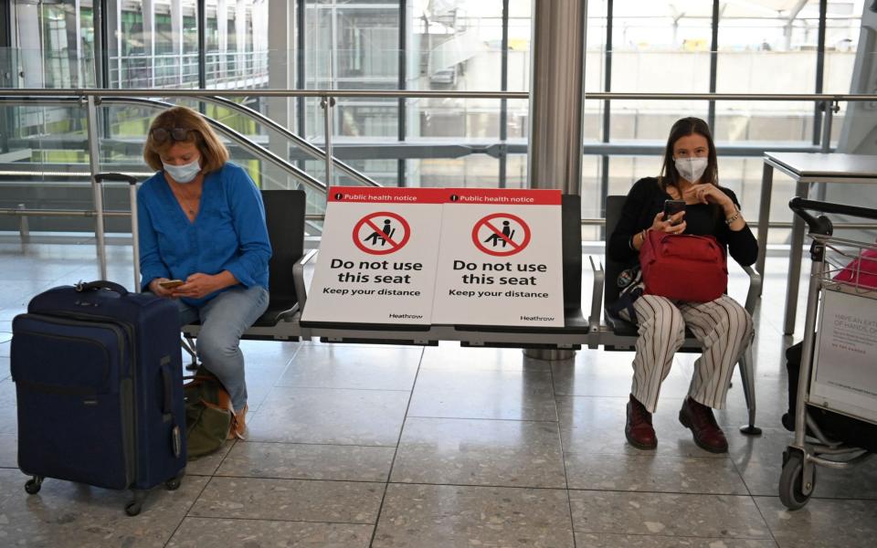 Passengers at Heathrow - AFP