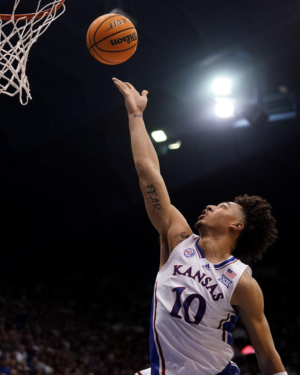 Kansas forward Jalen Wilson shoots during the first half of an NCAA college basketball game against Kansas State Tuesday, Jan. 31, 2023, in Lawrence, Kan. (AP Photo/Charlie Riedel)