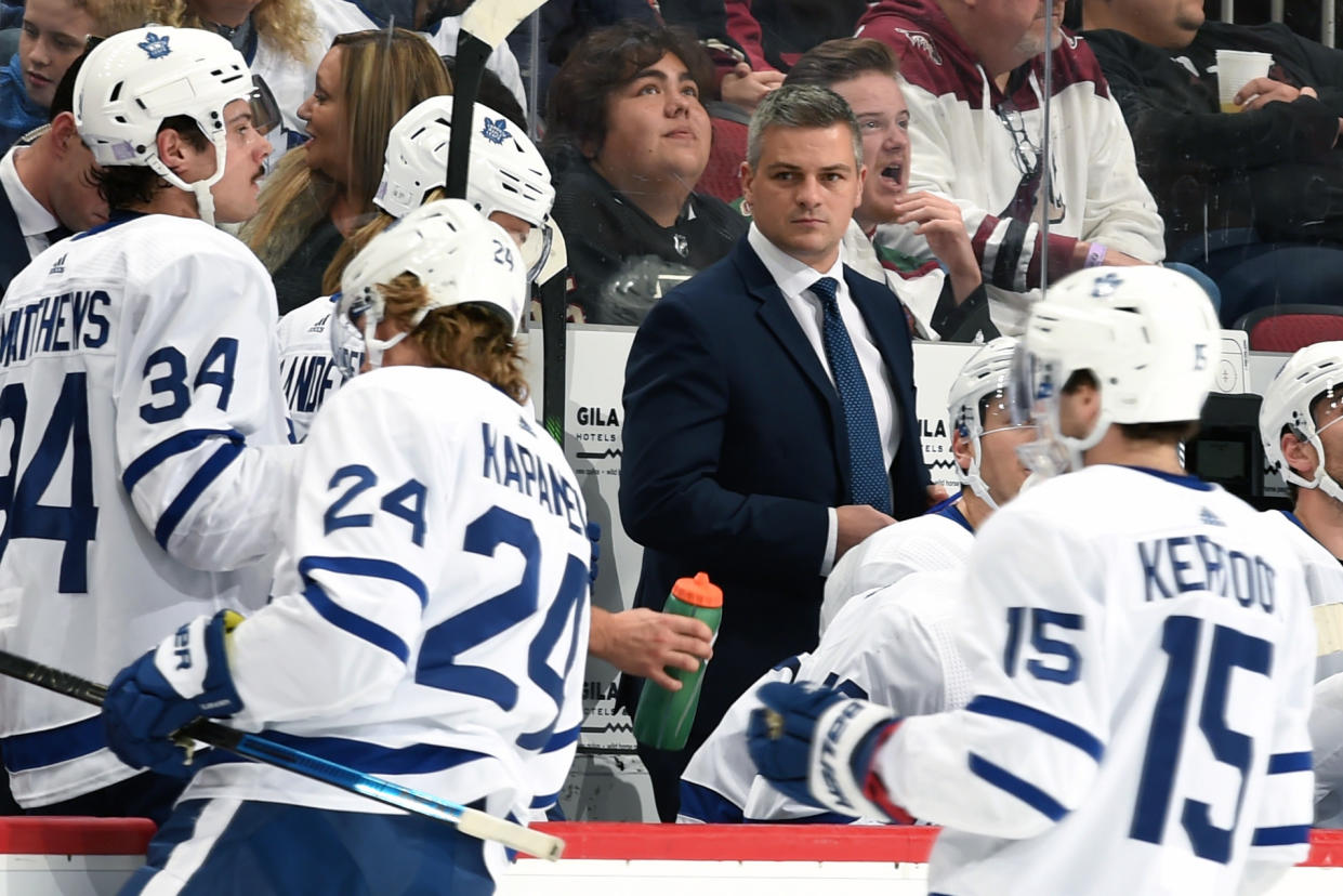 GLENDALE, ARIZONA - NOVEMBER 21: Head coach Sheldon Keefe of the Toronto Maple Leafs looks on from the bench during first period action against the Arizona Coyotes at Gila River Arena on November 21, 2019 in Glendale, Arizona. The game was Keefe's first game as an NHL head coach. (Photo by Norm Hall/NHLI via Getty Images)