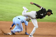 Texas Rangers' Isiah Kiner-Falefa (9) steals second base in front of a tag by Chicago White Sox shortstop Tim Anderson (7) in the fifth inning during a baseball game in Arlington Texas, Sunday, Sept. 19, 2021. (AP Photo/Matt Strasen)