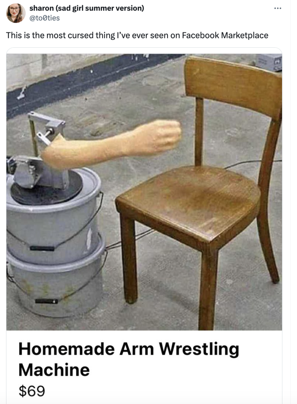 Wooden chair modified with fake human arm for arm wrestling, labeled 