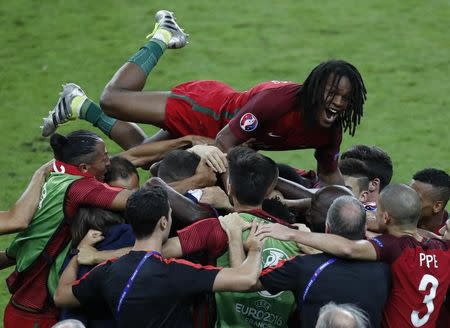 France v Portugal - EURO 2016 - Final - Stade de France, Paris - Saint Denis, France - 10/7/16 - Portugal's Renato Sanches and team mates celebrate the goal by Eder REUTERS/Charles Platiau