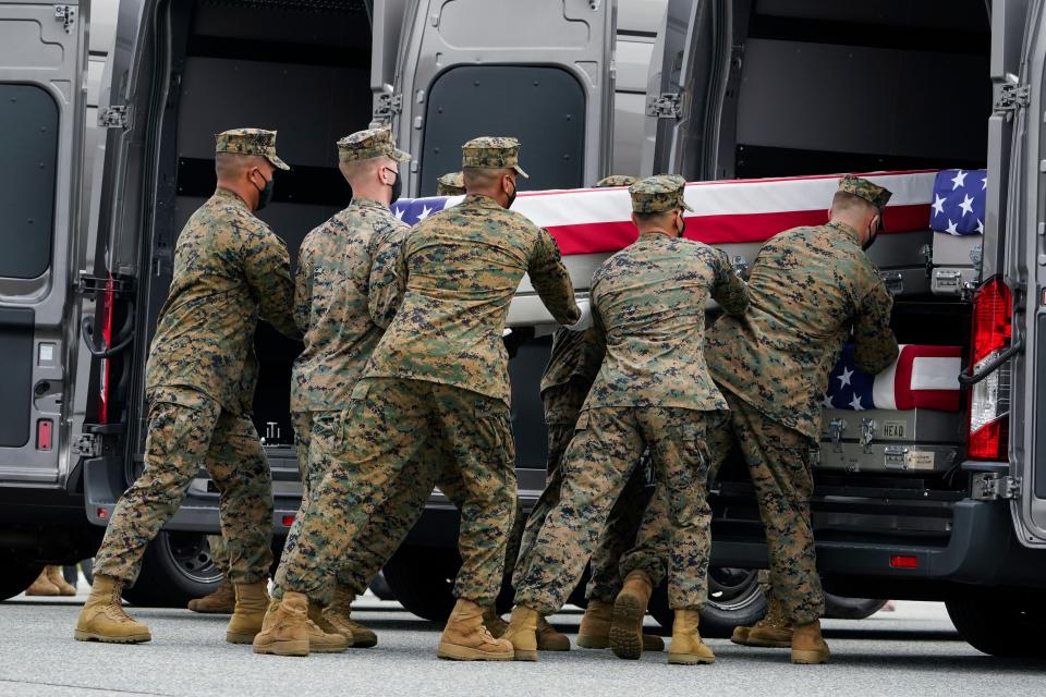 A Marine Corps carry team loads a transfer case containing the remains of Marine Corps Cpl. Daegan William-Tyeler Page, 23, of Omaha, Neb., at Dover Air Force Base.