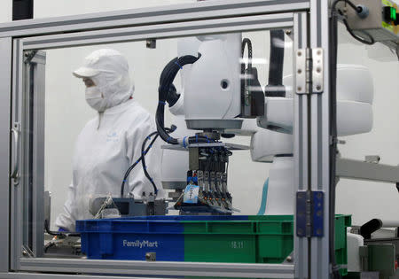 Kawasaki Heavy Industries' collaborative robot stacks rice balls at Delicious Cook &Co's food factory in Narashino, Japan, April 17, 2018. REUTERS/Toru Hanai