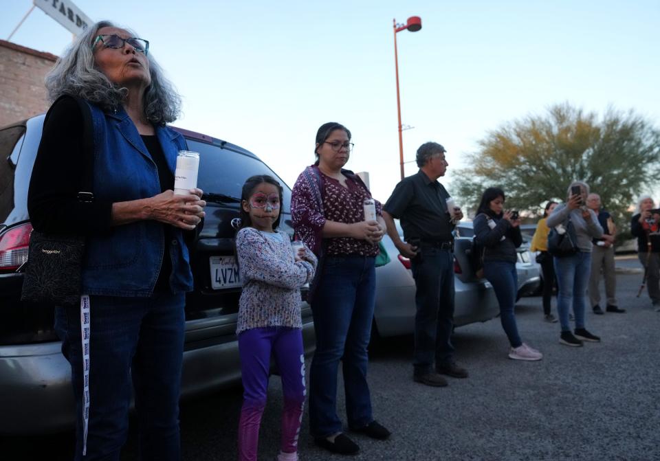 Isabel Garcia, left, co-chair of the Coalición de Derechos Humanos leads a pilgrimage on Wednesday, Nov. 2, 2022, in Tucson to honor the thousands of migrants who have died attempting to cross the border, coinciding with Día de los Muertos.