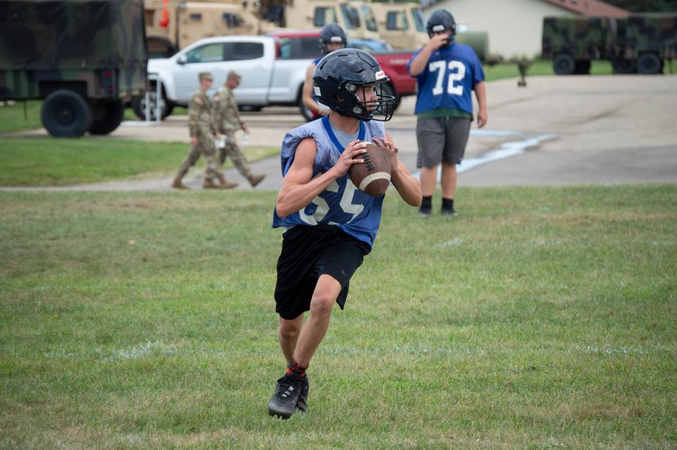 A Hornet rolls out and looks to complete a pass.